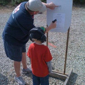 Passing it on:  Preparing a 6 year old boy to fire his first gun EVER at Atlanta Conservation Club Open House, 2009.