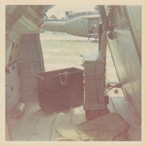 Cargo bay w/ammo cans for the M-60 in the door; fed over gunners shoulder, and for the XM-27,"minigun", mounted on the left side of aircraft. 1500 rds
