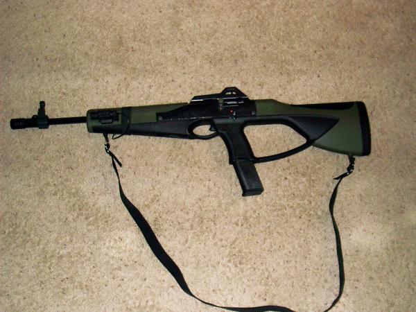 ATI stock, muzzle brake and laser. Hi Point OD Green. Shown with Promag 15 round mag, but have yet to try it.