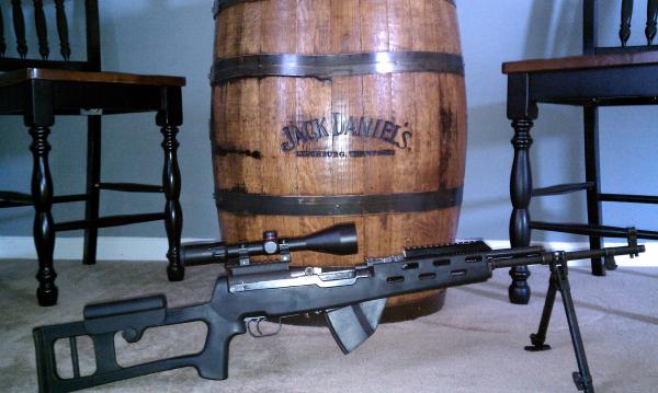 My newest SKS with my Jack Daniel's barrel in the back ground.